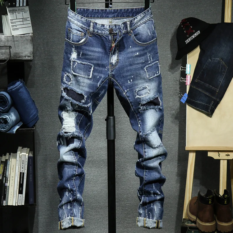 

Men's high street fashion ripped distressed destroyed straight fit washed denim jeans with patch