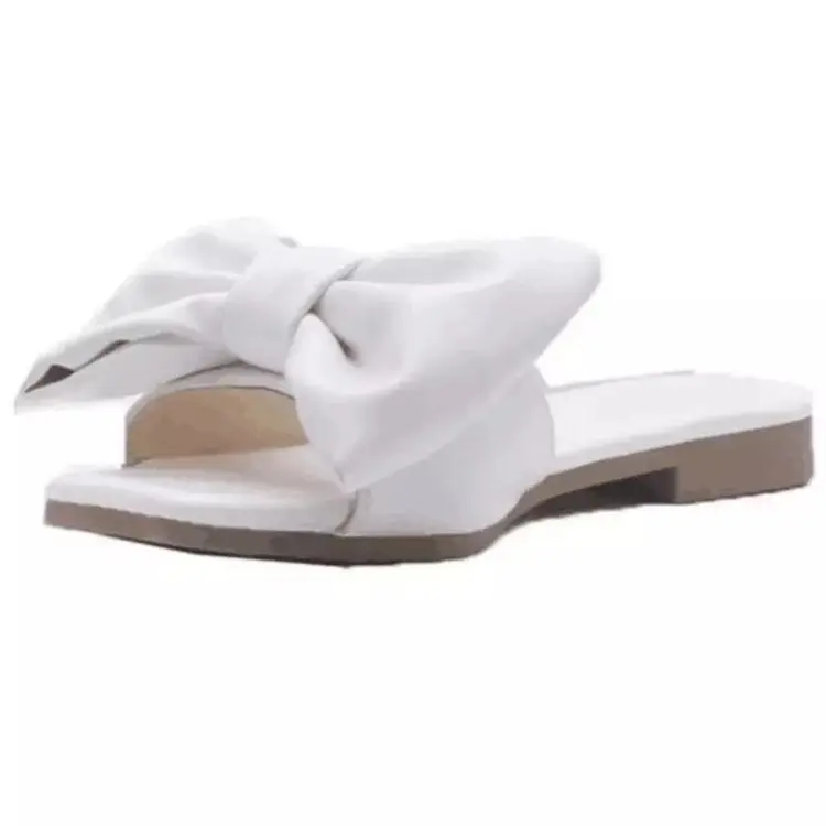 yellow flat sandals with bow