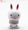 Gifts manufacturer cute funny white smiling face cute rabbit spring head doll douyin car decoration car smiling face spring doll