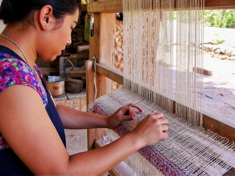 Oaxacan weaver demonstrating traditional backstrap loom techniques