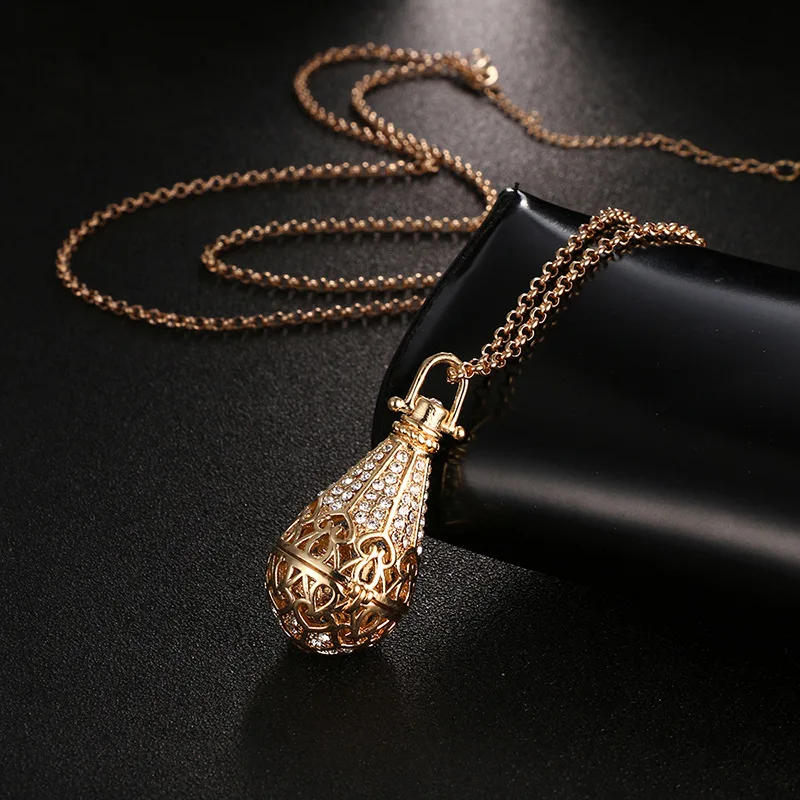 

Ruigang Antique Natural Lava Stone Beads Essential Oil Locket Crystal Rhinestone Hollow Cage Aromatherapy Diffuser Necklace