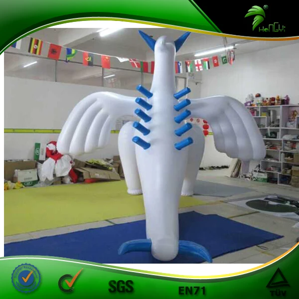 Giant chubby shiny inflatable lugia-looking dragon, standing above