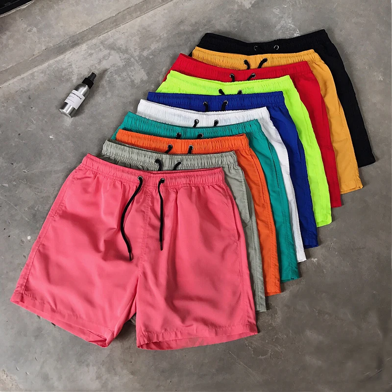 

2021 Wholesale stock polyester men running shorts beach shorts mesh lining shorts for men with letter printing for promotion, As above show