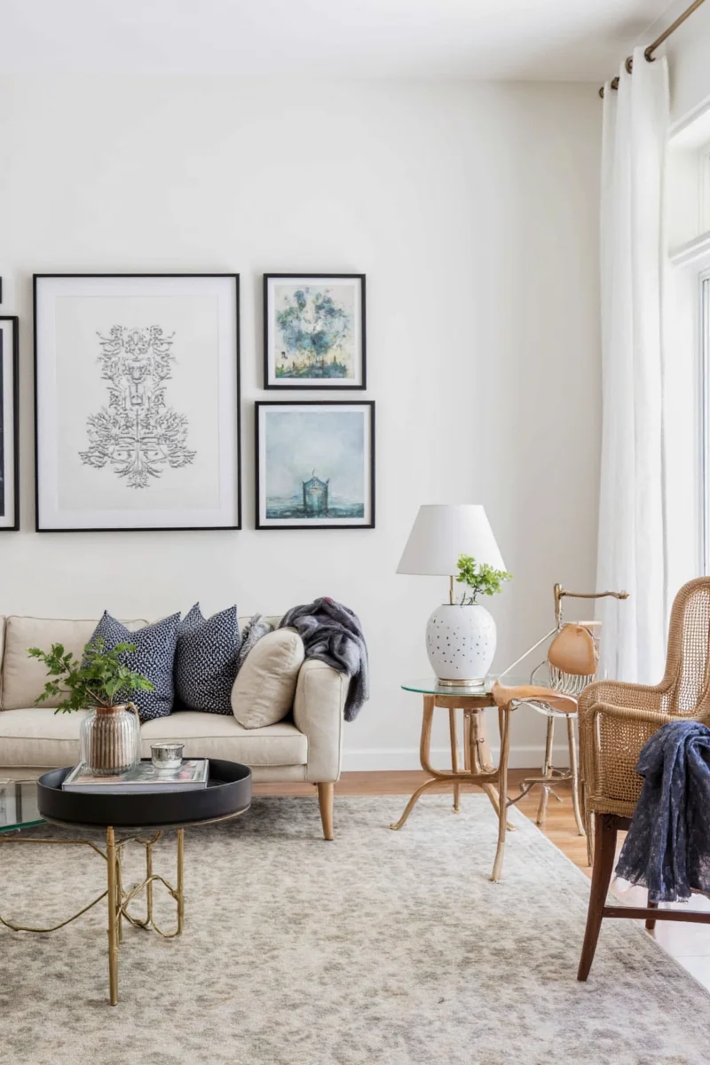Decorated back of sofa with floating shelf and greenery