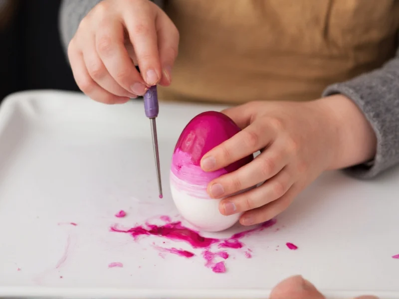 Child painting eggs with natural beetroot and spinach dyes