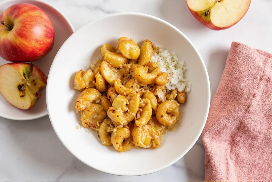 Fresh Macintosh apples with cinnamon sticks and nutmeg