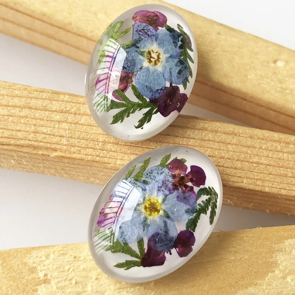 

Oval Crystal resin real dry pressed flowers forget me not stud earrings handmade