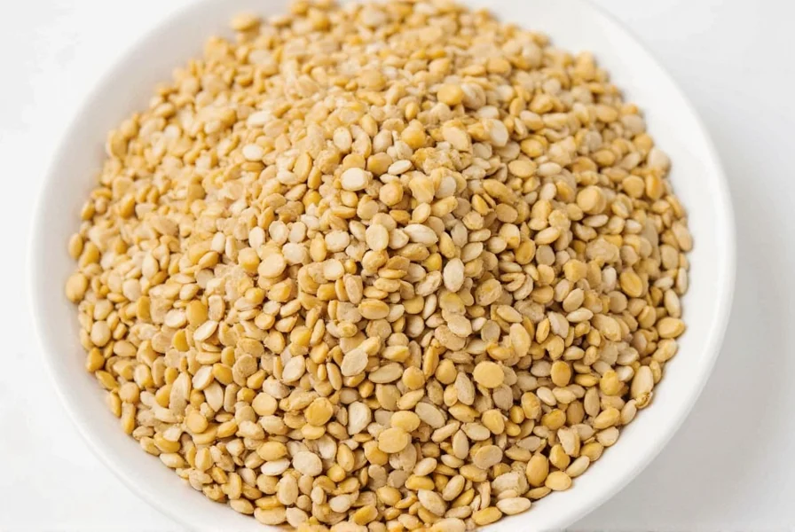 Close-up of raw and toasted sesame seeds