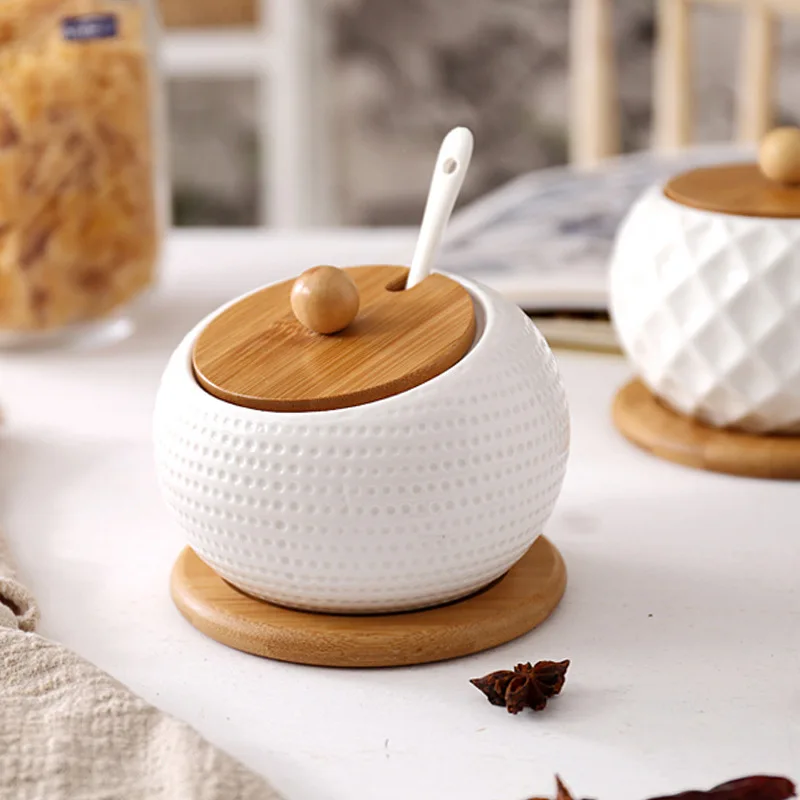 

Wholesale luxury mini seasoning condiment porcelain ceramic container set spice jars with glass bamboo wood lid