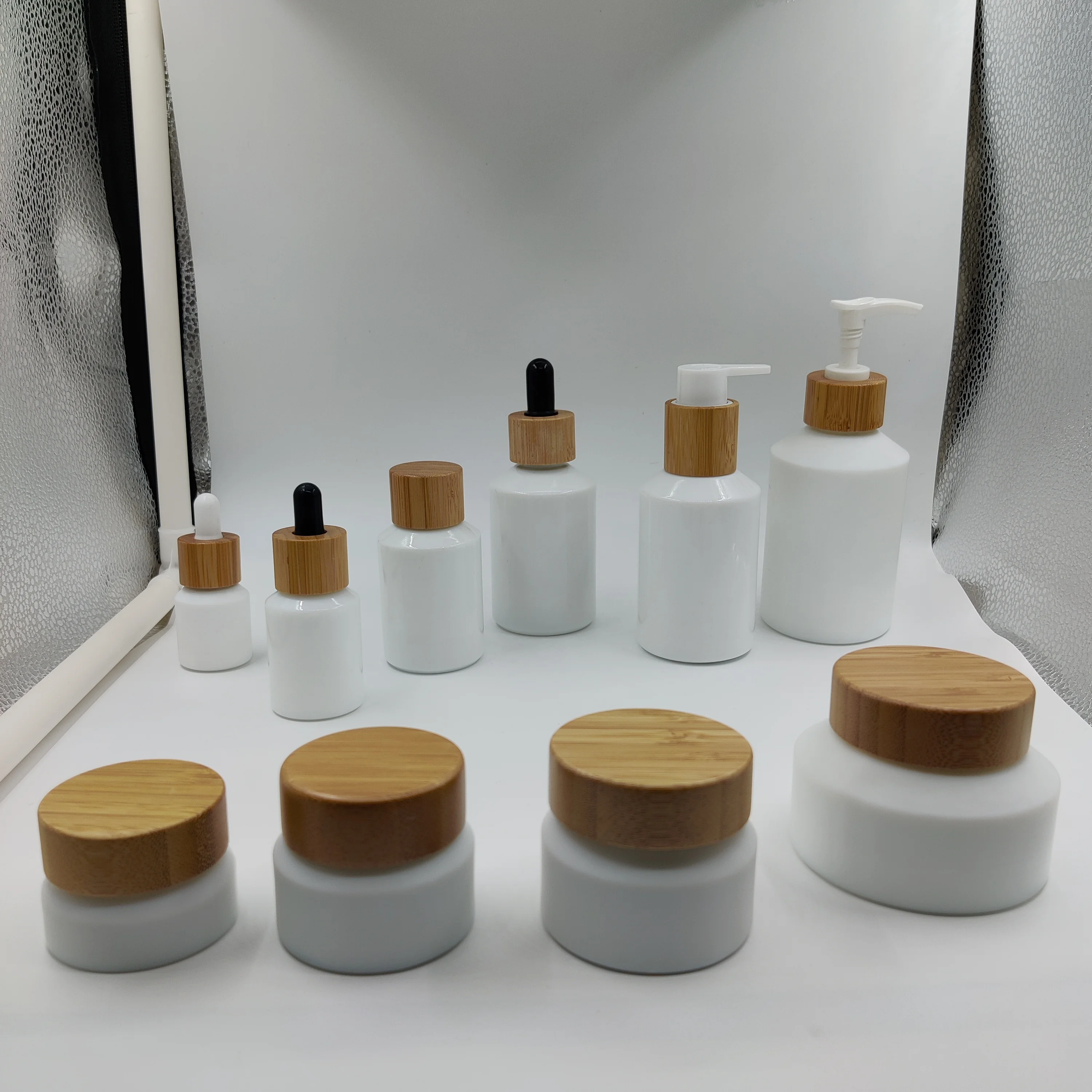 

cosmetic packaging 15ml 30ml 60ml 100ml 125ml 200ml 15g30g 50g100g opalwhiteessential oil glass bottle with natural wood dropper