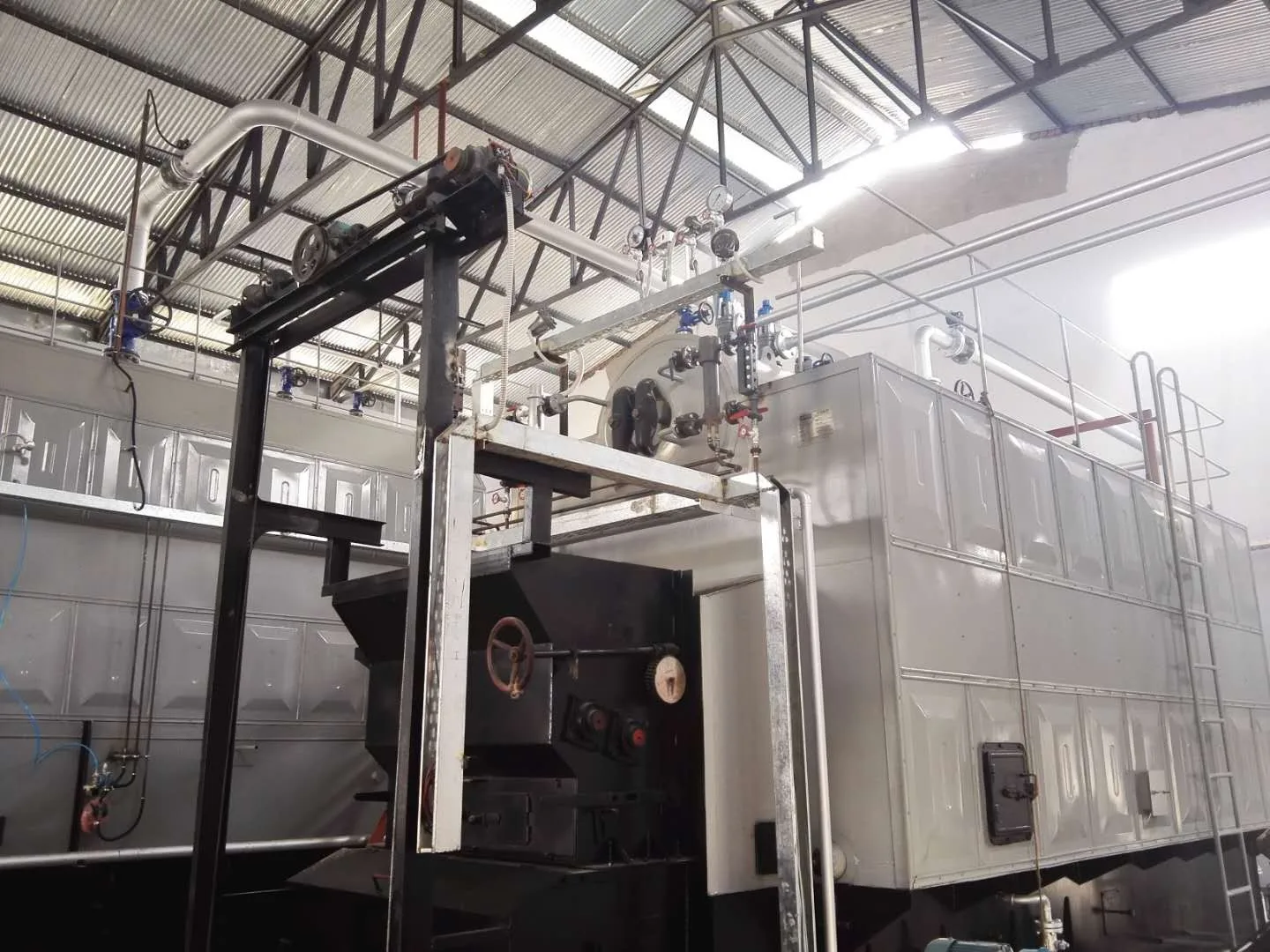 Coal boiler chain grate and steam drum close-up - Pakistan site