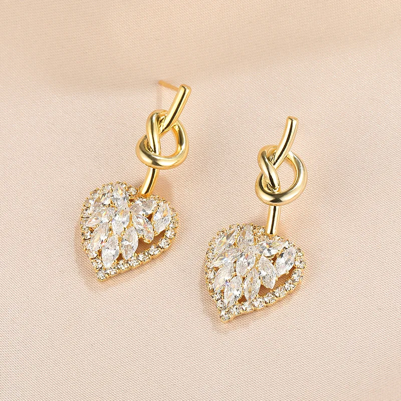 

Jachon Silver 925 heart-shaped hollow zircon stud earrings for women