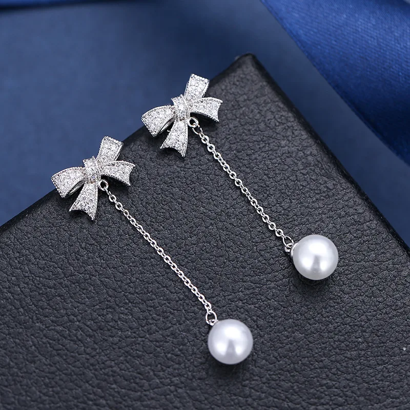 

Fashion versatile popular bow long pearl pendant earrings copper set zircon shiny women's Earrings, Picture shows