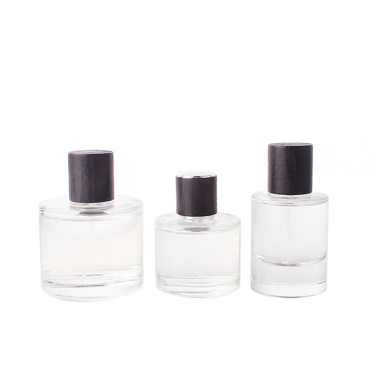 

High-grade Empty Cosmetic Packaging 30ml 50ml 100ml Cylinder Mist Spray Glass Perfume Bottles with Black Silver Golden Caps