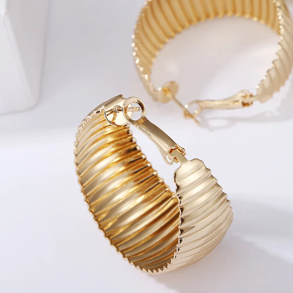 

Fashion personality gold geometric twist exaggerated hip hop hoop earrings