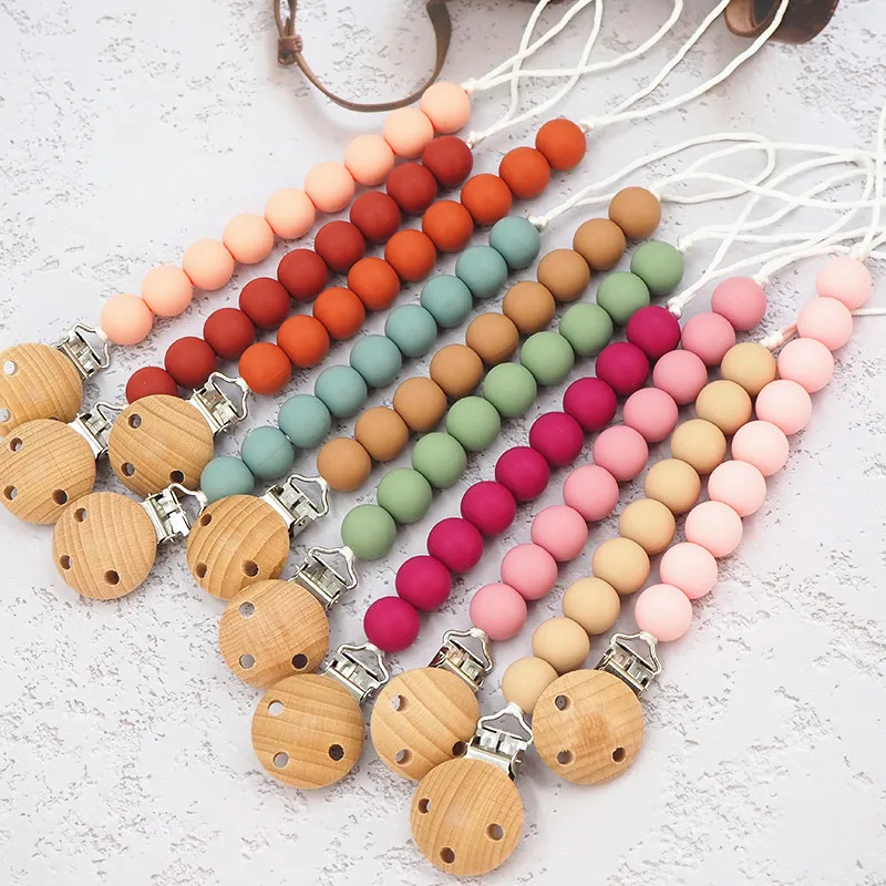 

Custom Made BPA Free Silicone Pacifier Clips Holder Lanyard Teething Chewable Beads Soothing Pacifier silicone clips, 15 in stock, custom color acceptable