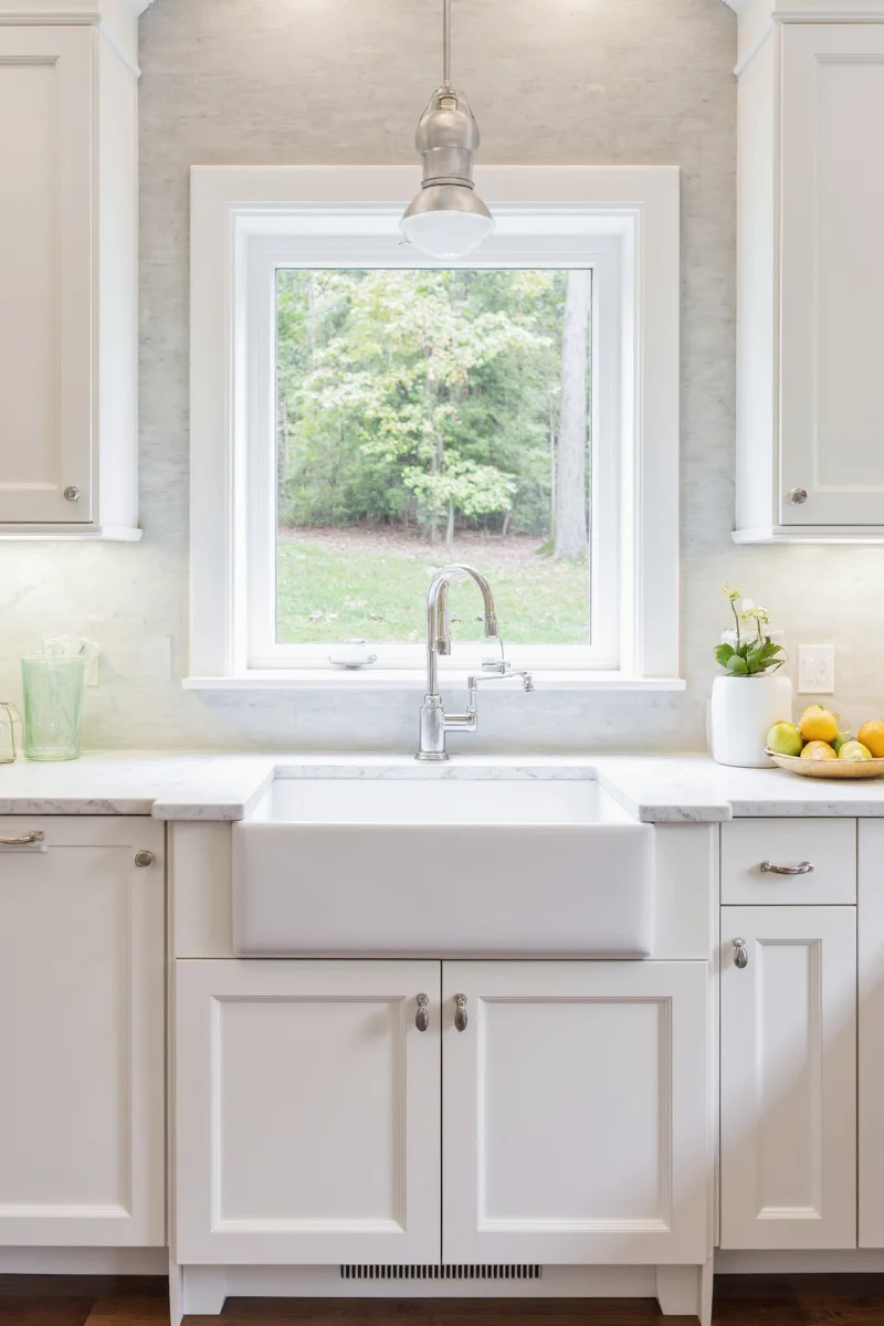 Family-friendly kitchen with White Dove cabinets and kids artwork