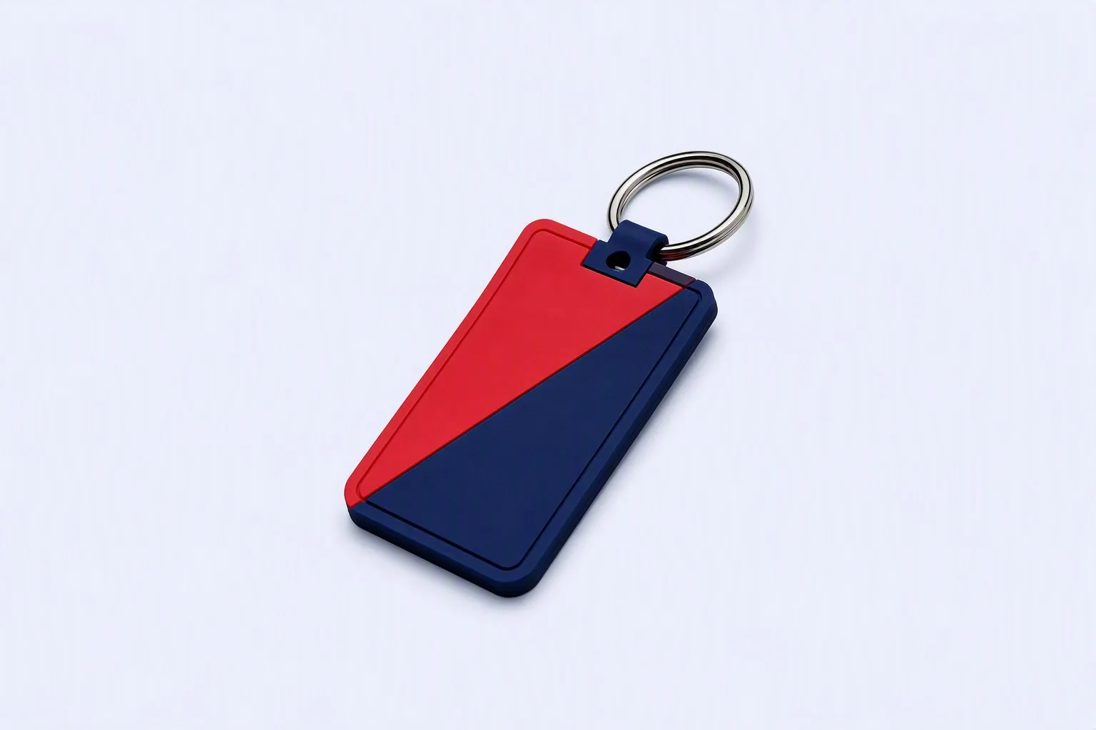 Close-up of PVC ring attachment loop on blue keychain showing layered molding