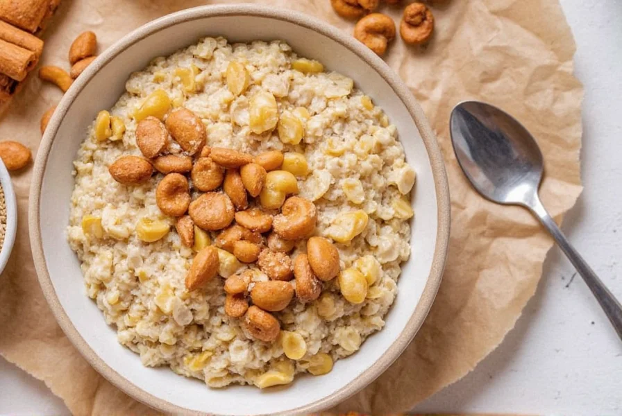 Bowl of cinnamon spice oatmeal topped with sliced bananas, walnuts, and a sprinkle of cinnamon