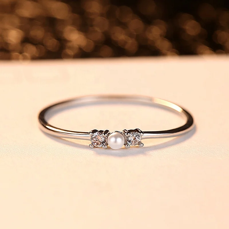 

Simple inlaid small pearl zircon female couple ring R306