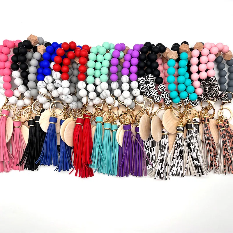 

2022 New Design Custom Silicone Beads Bracelet Keychain Elastic Wristlet With Monogram Disc Silicone Wristlet Keychain Bracelet