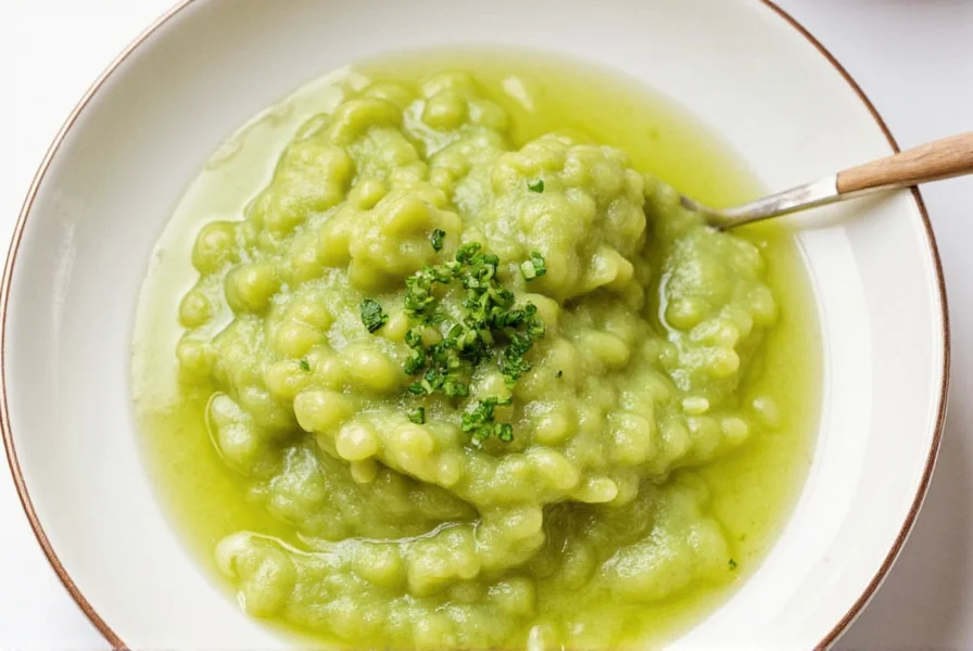 Fresh wasabi rhizome next to grated wasabi paste on traditional Japanese grater