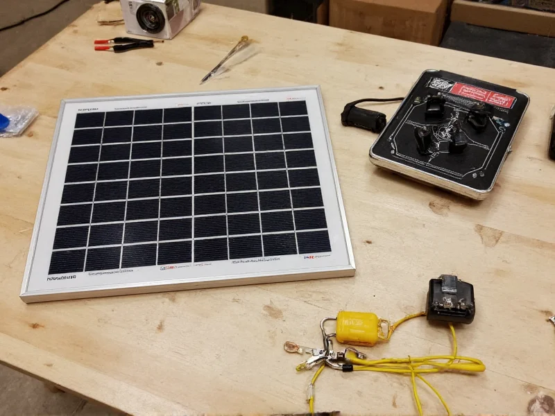 DIY solar panel kit components laid out on workbench
