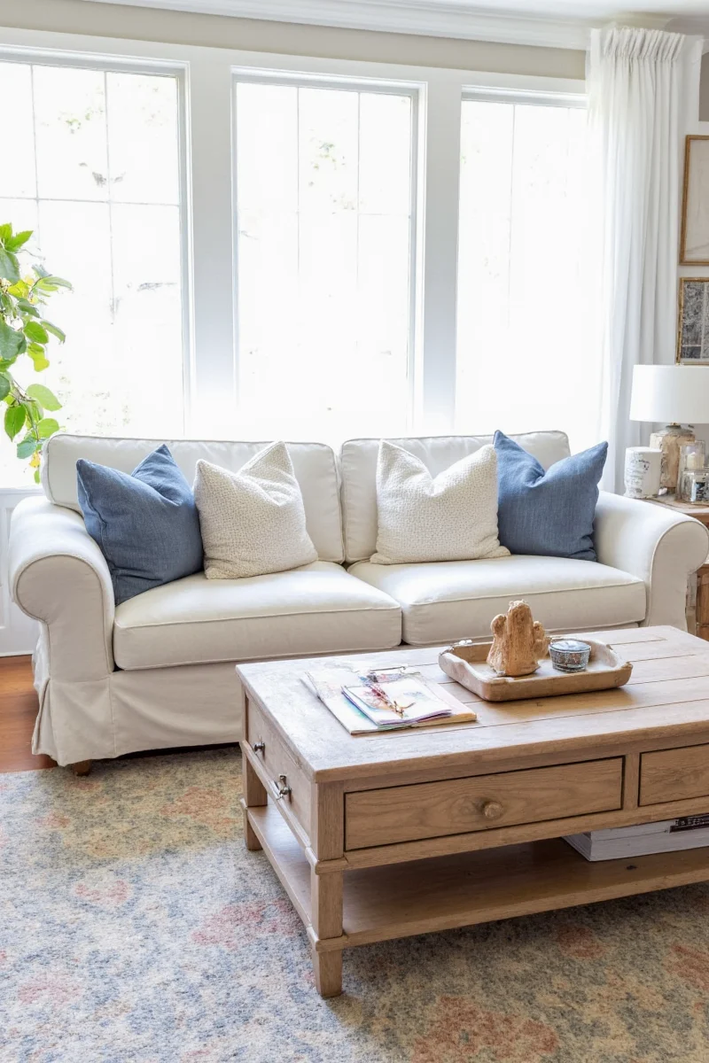 Pottery Barn showroom with sale tags on slipcover sofas