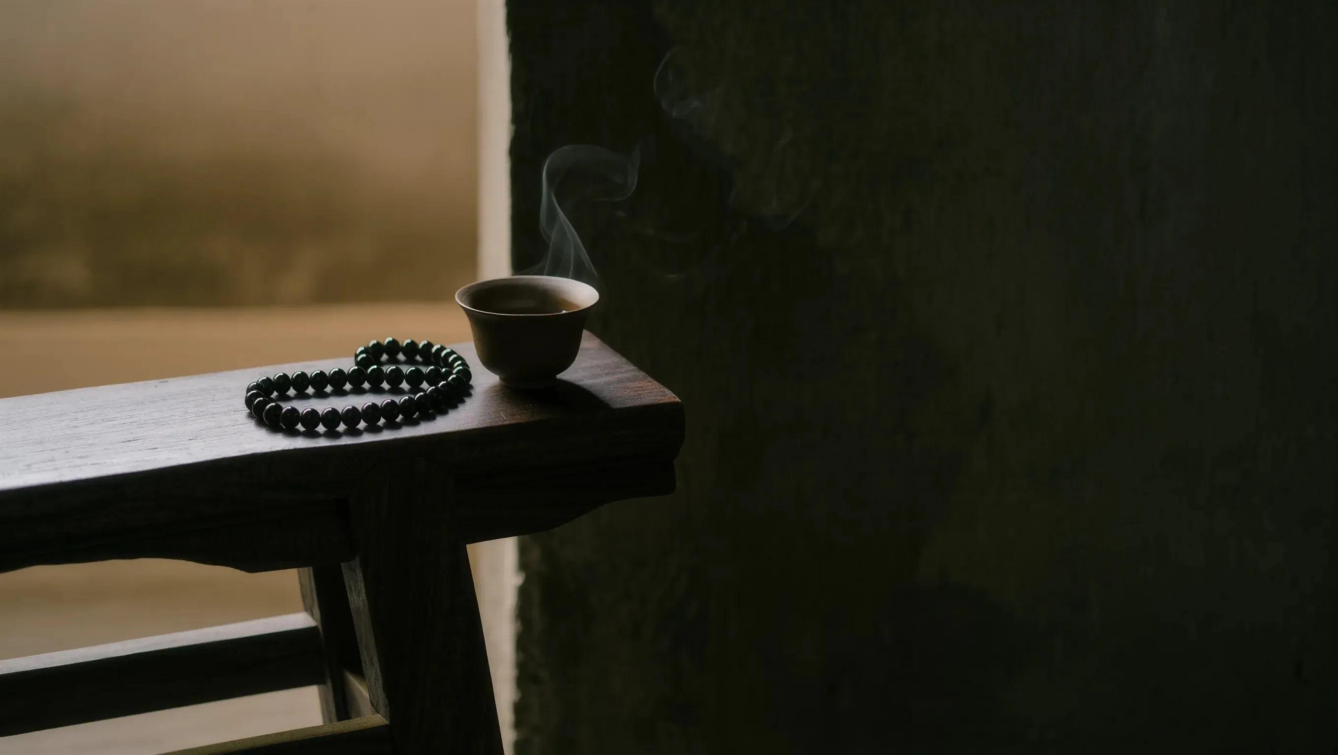 Contact Us 1 Sovereign Stillness Jewelry Contact: Handcrafted obsidian relic and tea ritual in a monastic studio at dawn.