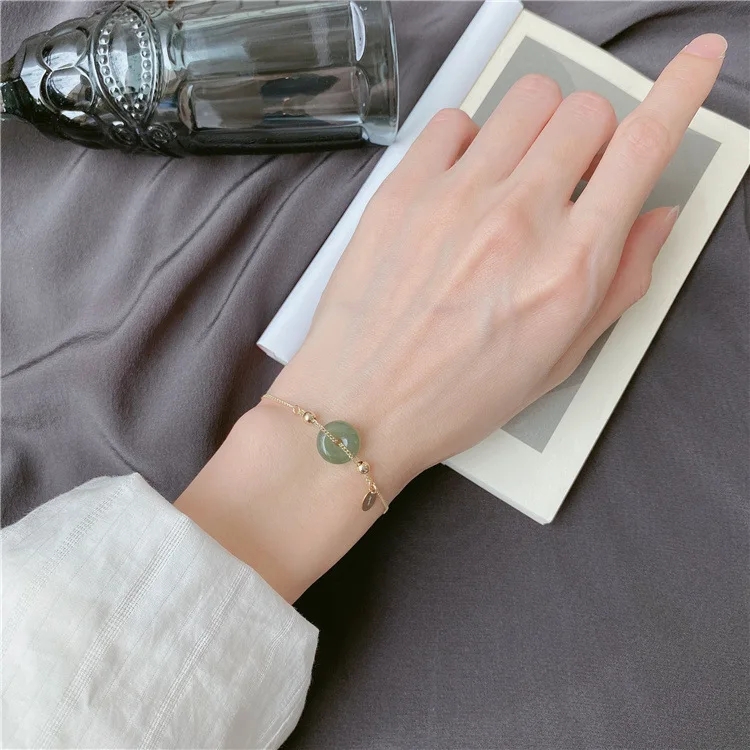 

Round Hetian Jade Safe Clasp Temperament pull design High sense of retro palace style female bracelet, 1 different color