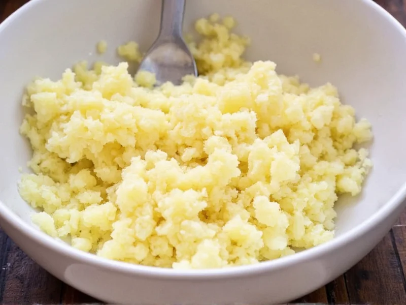 Freshly grated russet potatoes in bowl