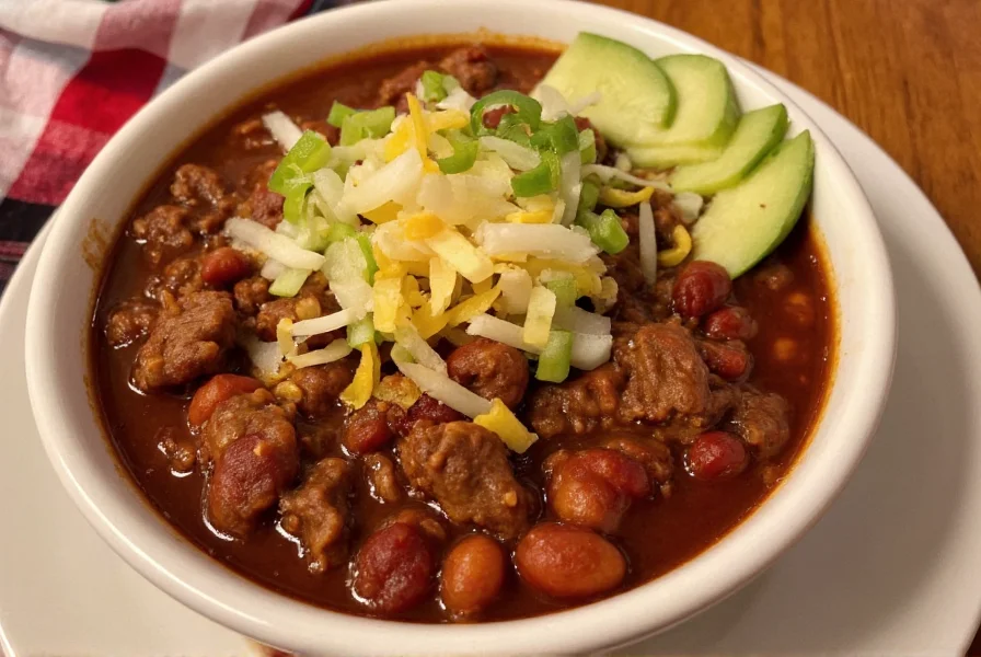 Finished steak n shake chili recipe served in bowl with toppings