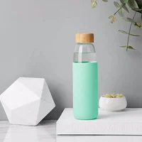 

17 oz borosilicate glass water bottle with bamboo lid and protective silicone sleeve wholesale