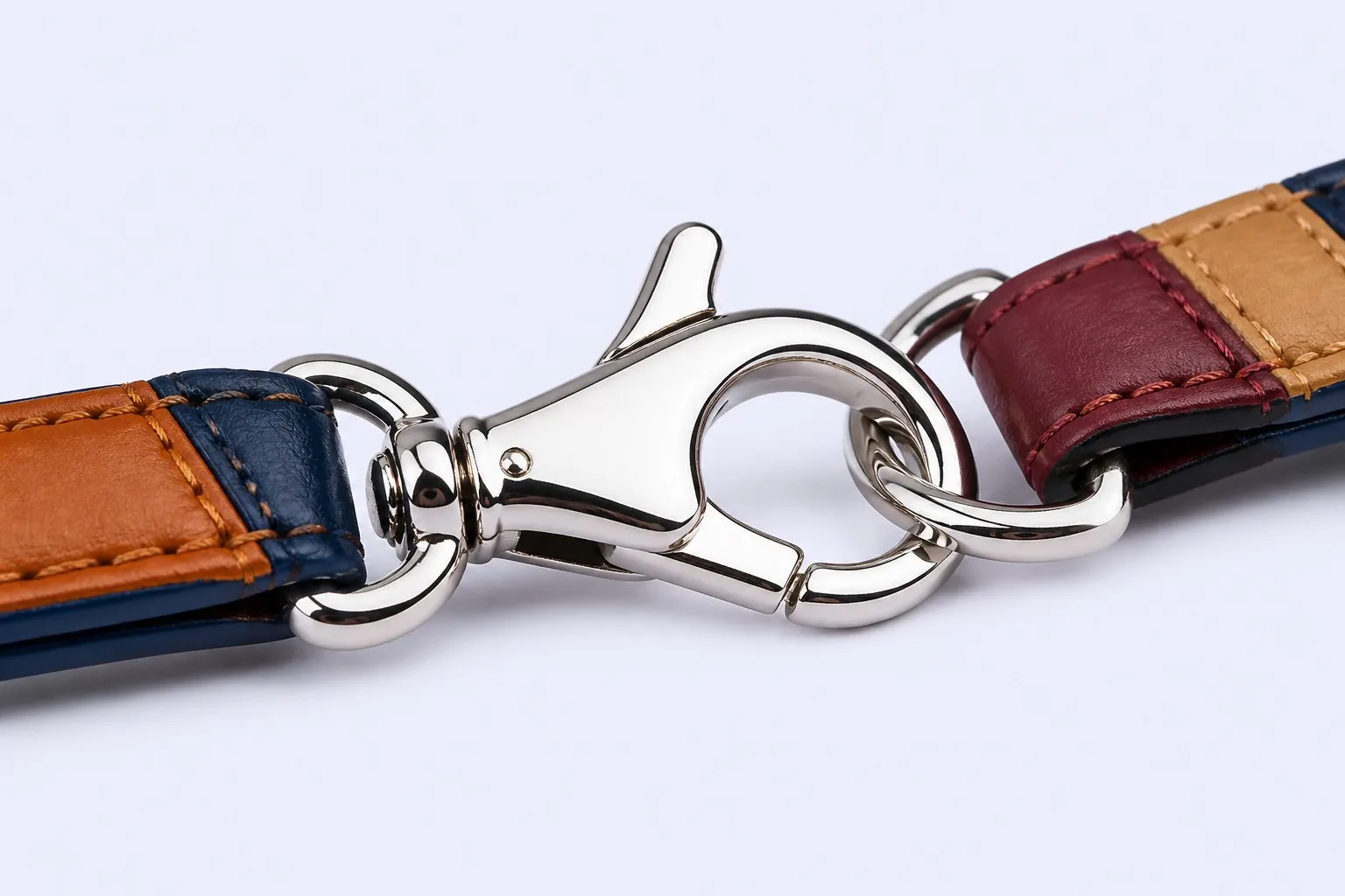 Silver lobster claw clasp hardware detail on leather key fob