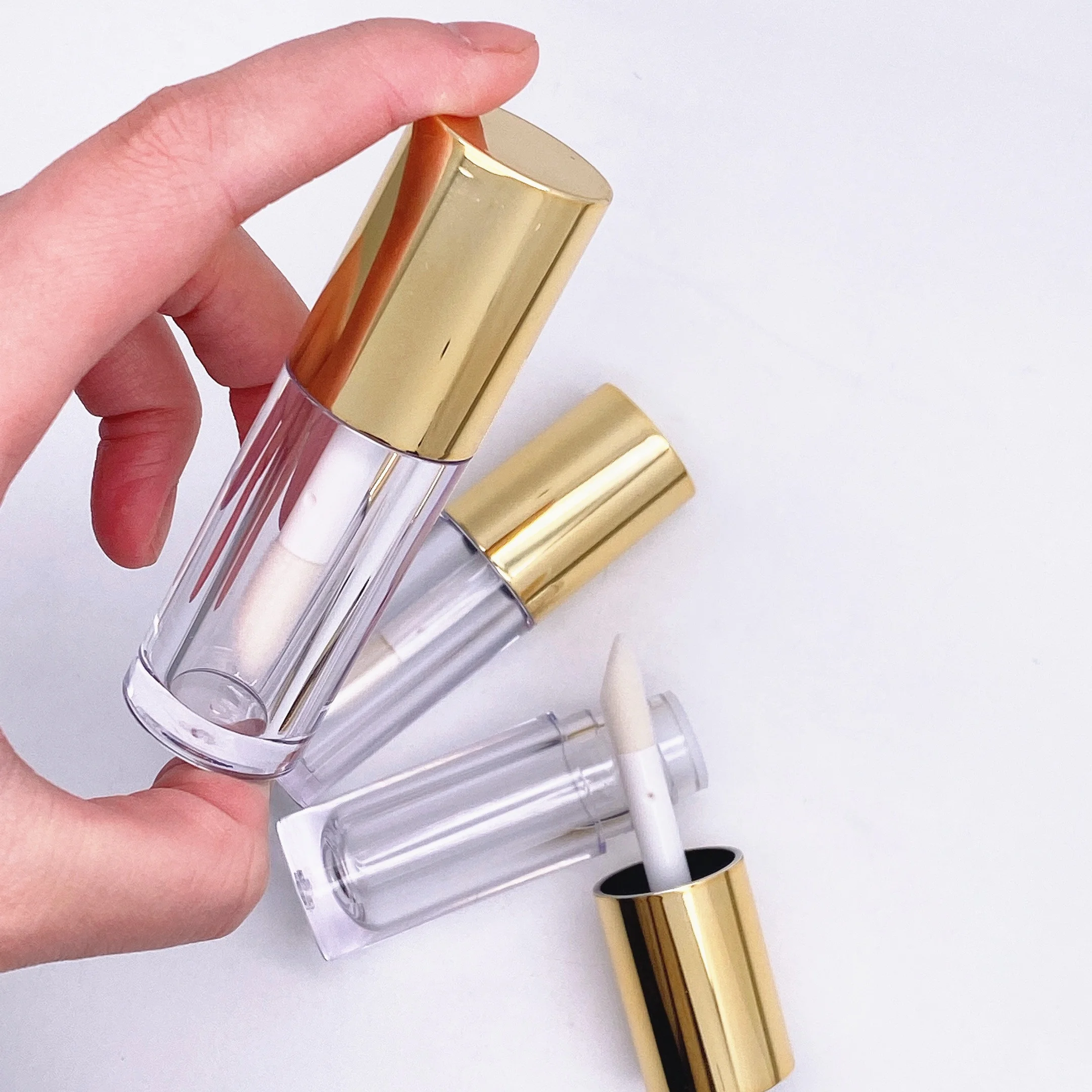

Round Empty Lip Gloss Tubes With Wands Custom Logo Gold Large Capacity Lip Gloss Tubes 10ml Container Packaging