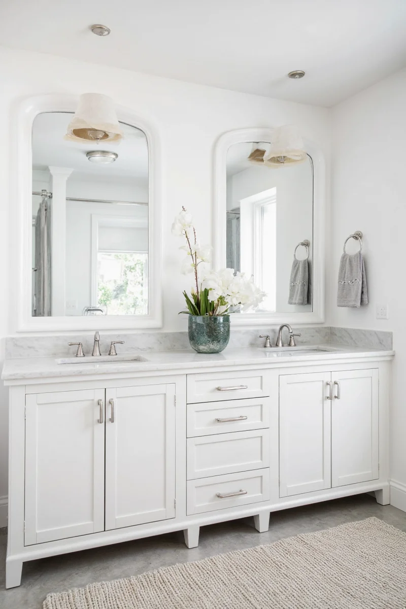 White freestanding clawfoot bathtub in modern bathroom