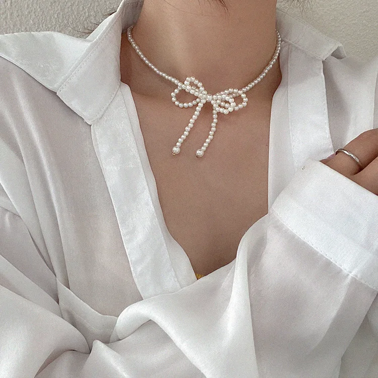 

New design women cold wind pearl double bow necklaces