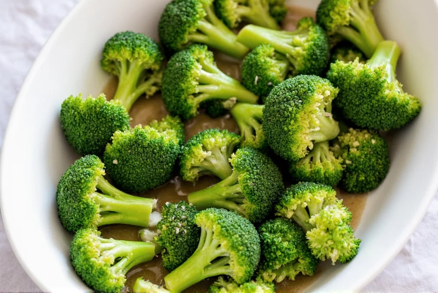 Three different marinated broccoli preparations on white plates
