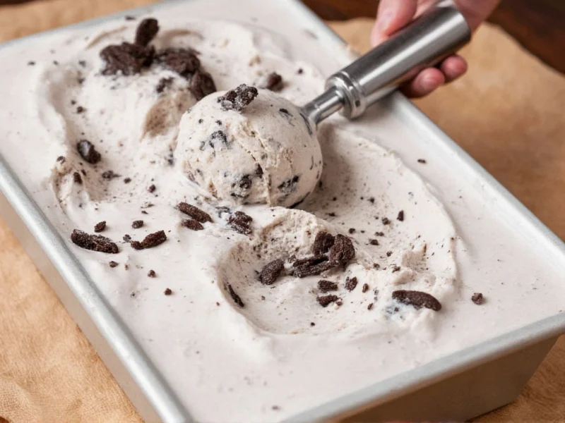 Scooping homemade cookies and cream ice cream