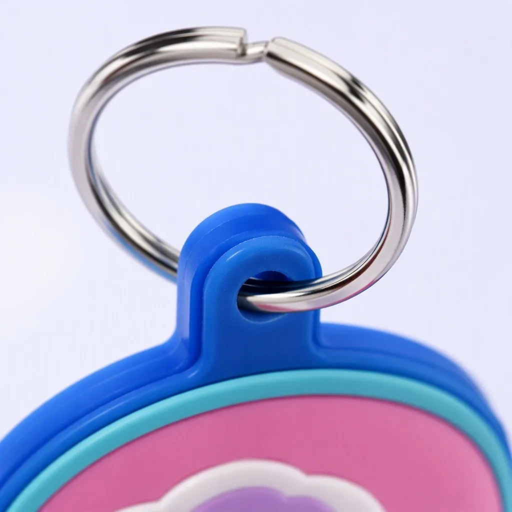 Red and navy two-tone PVC keychain tag floating at angle