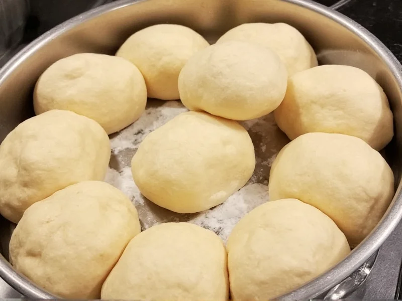 Pizza dough balls resting in oiled containers