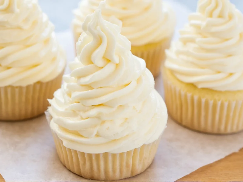 Fluffy vanilla buttercream frosting swirls on piping test