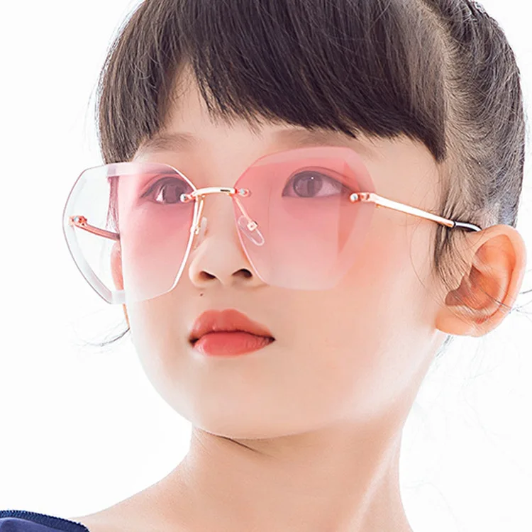 

Wholesale Fashion Kids Shades Sunglasses Children's Gift Pink Sunglasses Kids Rimless Irregular Sunglasses, Picture