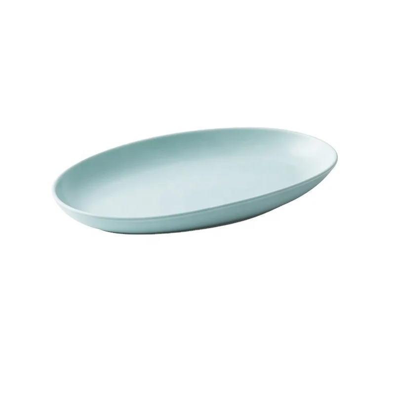 

China factory export low MOQ cheap price 11 inch hotel use oval shape ceramic fish plate dishes