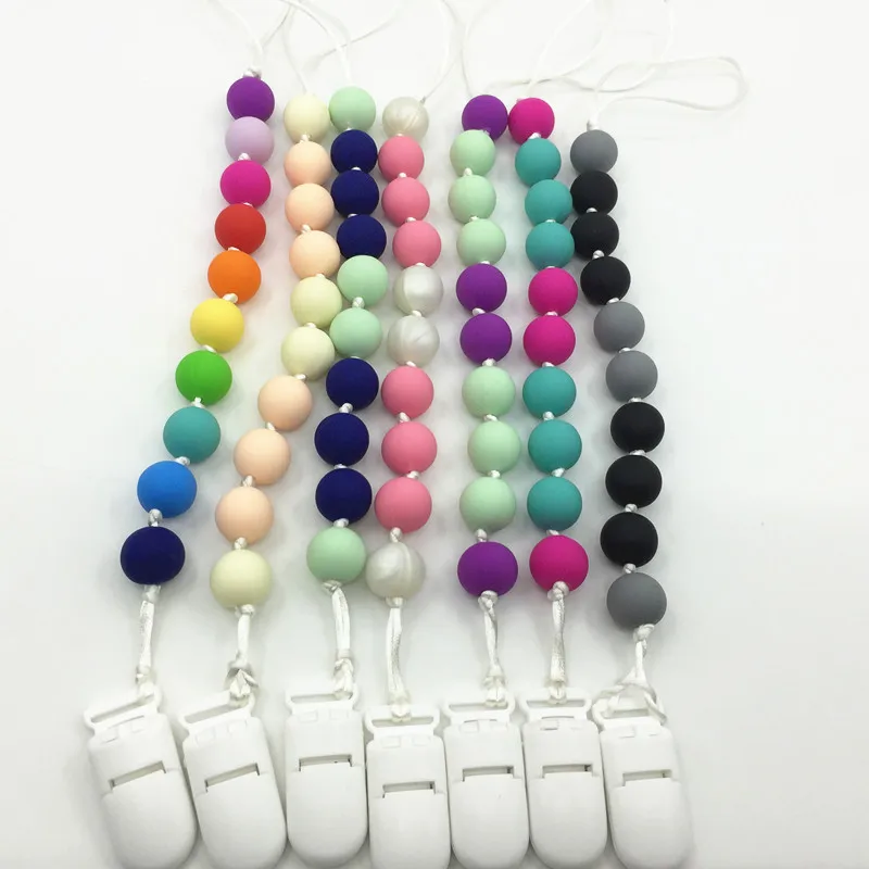 

Hot Sale Fashion Baby Nipple Chain leather baby teething bib toys holder wooden pacifier clip silicone, Picture color