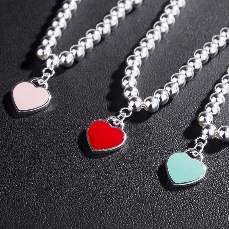 

2021 New 925 Sterling Silver Enamel Red Peach Heart Pendant Bracelet Simple Stainless Steel Beads Bracelet for Women