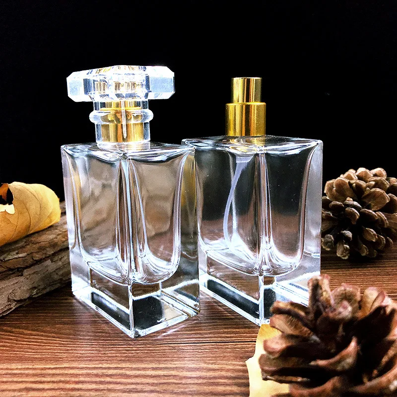 

High-grade empty 50ml thick glass perfume mist spray bottles with golden sprayers