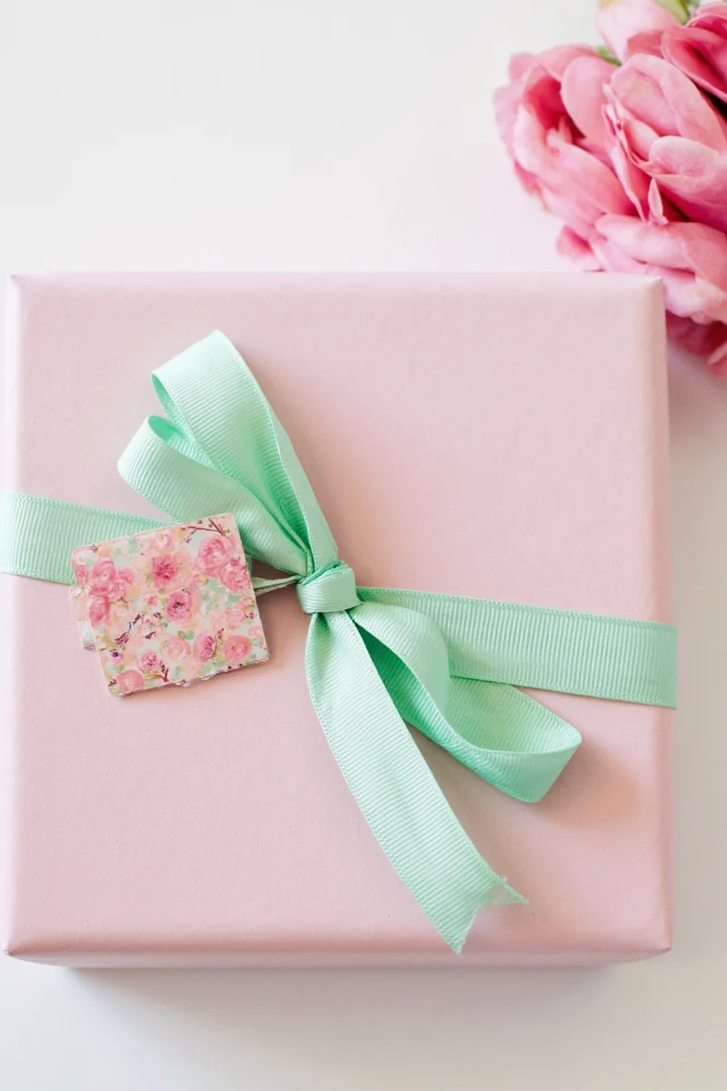 Organza bow with gold tinsel on baby shower gift