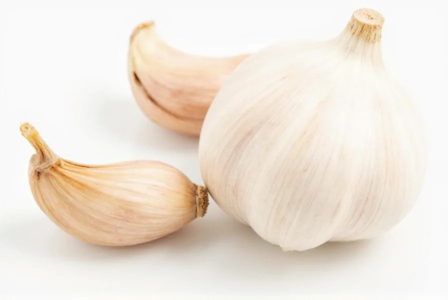 Measurement comparison of whole garlic cloves next to teaspoon measurements of minced garlic