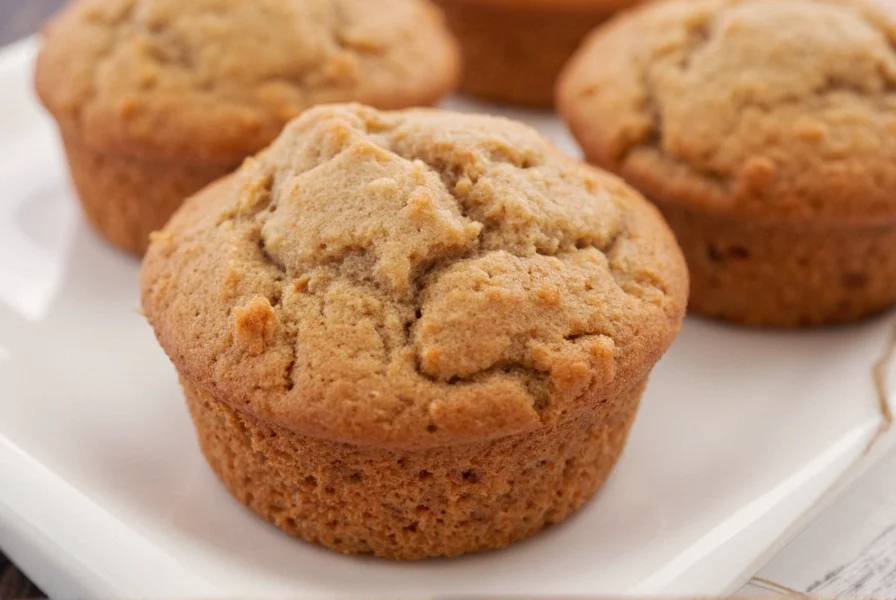 Variety of cinnamon muffin variations including apple cinnamon and gluten-free versions arranged on a marble countertop